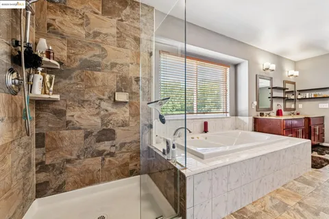 a view of balcony with wooden floor and outdoor seating