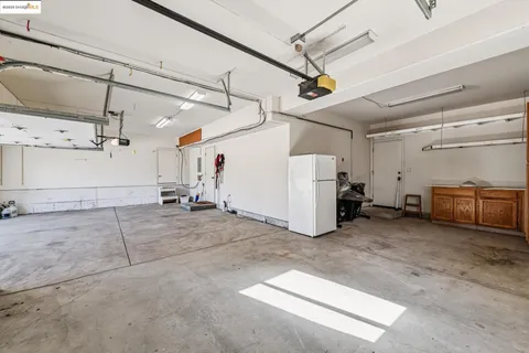 a view of a two chairs in the balcony