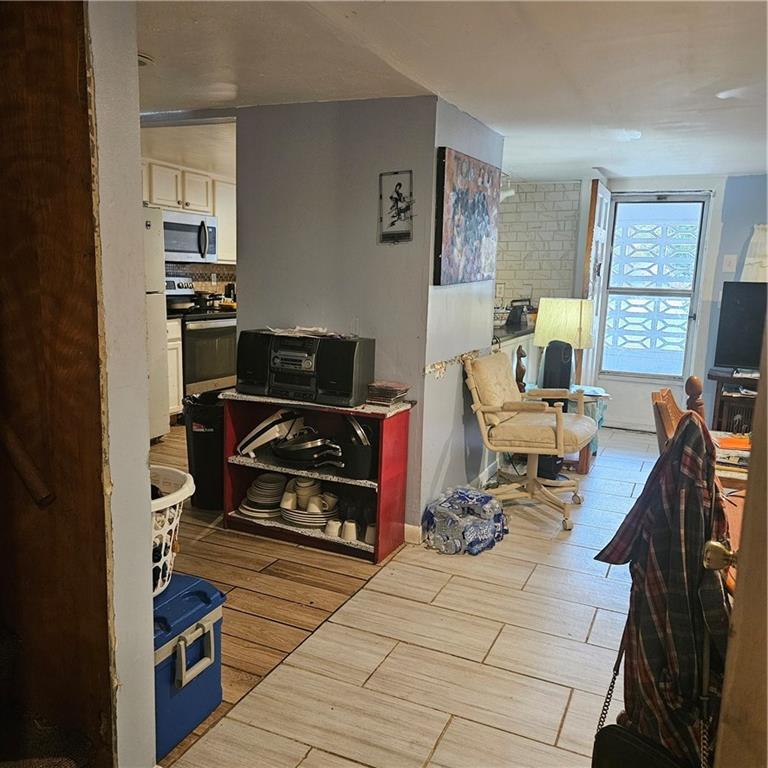 4880 Ben Hill Road Atlanta, GA 30349 - Photo 18 of 48 a living room with furniture and a flat screen tv