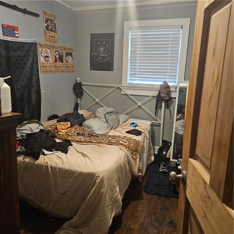 4880 Ben Hill Road Atlanta, GA 30349 - Photo 29 of 48 a bedroom with a bed and a window