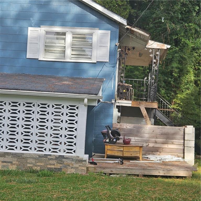 4880 Ben Hill Road Atlanta, GA 30349 - Photo 40 of 48 a view of a house with a yard