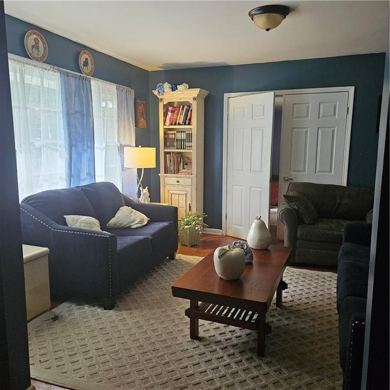 4880 Ben Hill Road Atlanta, GA 30349 - Photo 4 of 48 a living room with furniture and a window
