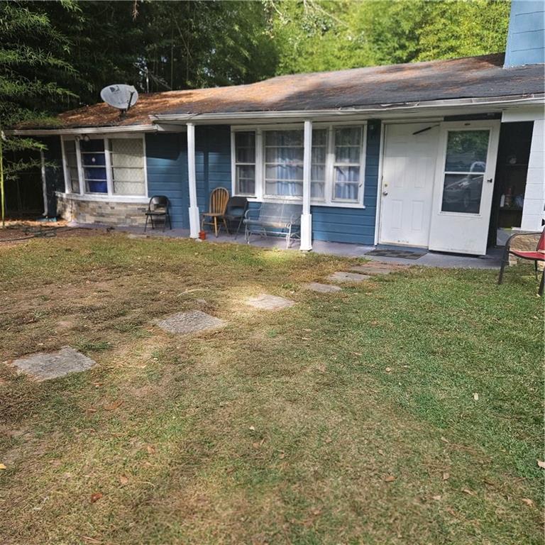 4880 Ben Hill Road Atlanta, GA 30349 - Photo 43 of 48 a view of a house with pool and chairs