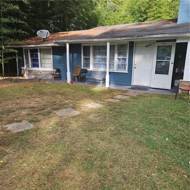 4880 Ben Hill Road Atlanta, GA 30349 - Photo 44 of 48 a view of a house with porch and garden