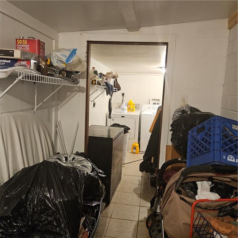 4880 Ben Hill Road Atlanta, GA 30349 - Photo 46 of 48 a view of walk in closet with clothes and shoes