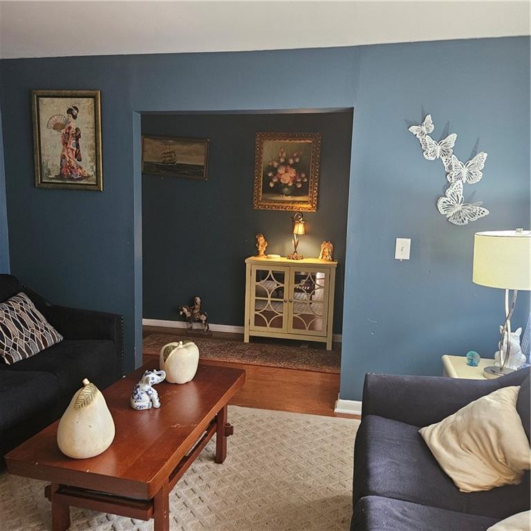 4880 Ben Hill Road Atlanta, GA 30349 - Photo 6 of 48 a living room with furniture and wooden floor