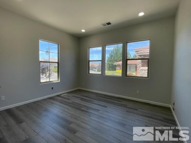 1416 Lambrays Lane Sparks, NV 89436 - Photo 5 of 12 a view of an empty room with wooden floor and a window