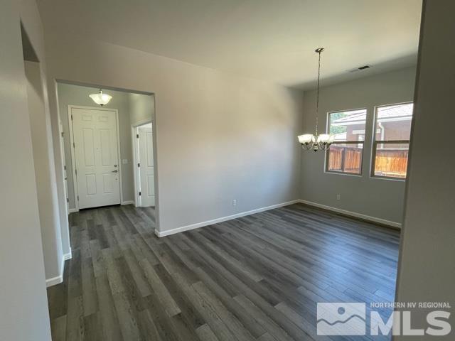 1416 Lambrays Lane Sparks, NV 89436 - Photo 6 of 12 an empty room with wooden floor and windows
