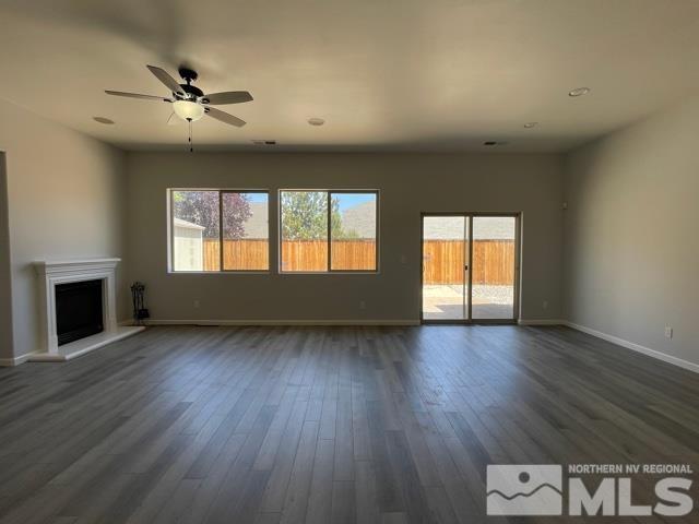 1416 Lambrays Lane Sparks, NV 89436 - Photo 7 of 12 a view of an empty room with a window and wooden floor