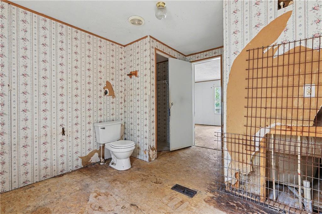 249 John Golden Road Temple, GA 30179 - Photo 32 of 45 a bathroom with a toilet and a shower