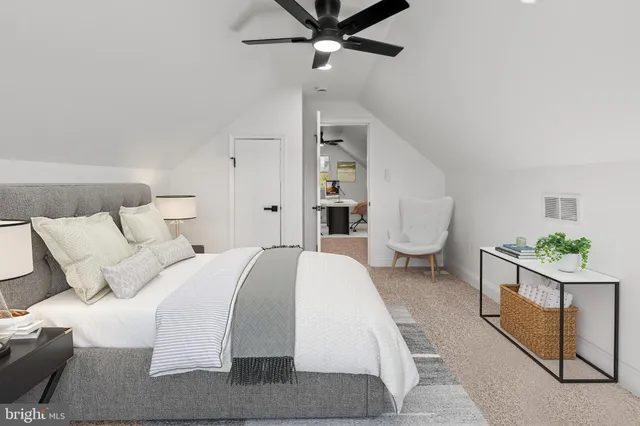 a spacious bedroom with a bed and window