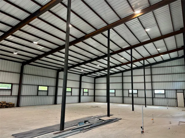 a view of a hall with a ceiling fan