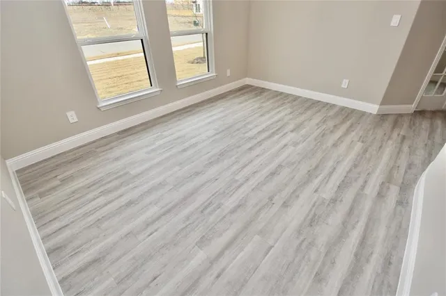 a view of a kitchen with a sink and a window