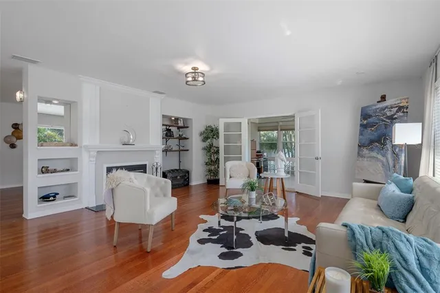 a bathroom with a granite countertop sink mirror vanity and toilet