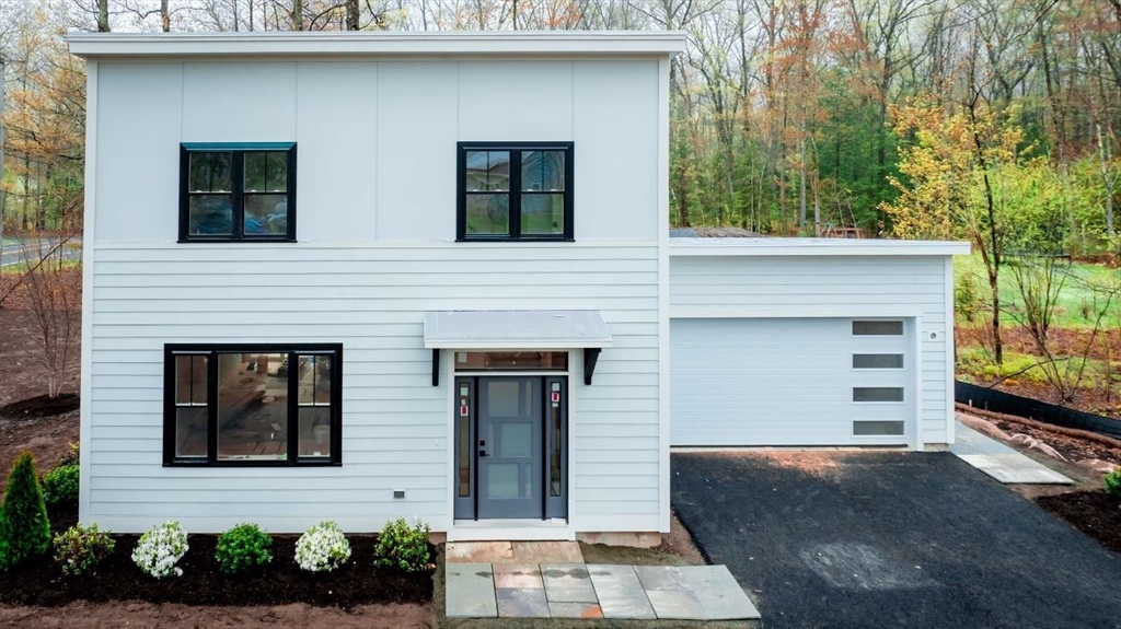 811 Burts Pit Road Northampton, MA 01062 - Photo 1 of 10 a front view of a house with garage