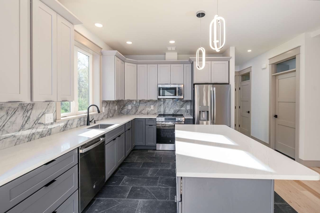 811 Burts Pit Road Northampton, MA 01062 - Photo 4 of 10 a large kitchen with kitchen island a sink stainless steel appliances and cabinets