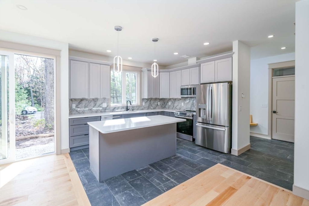 811 Burts Pit Road Northampton, MA 01062 - Photo 5 of 10 a large kitchen with kitchen island a sink stainless steel appliances and cabinets