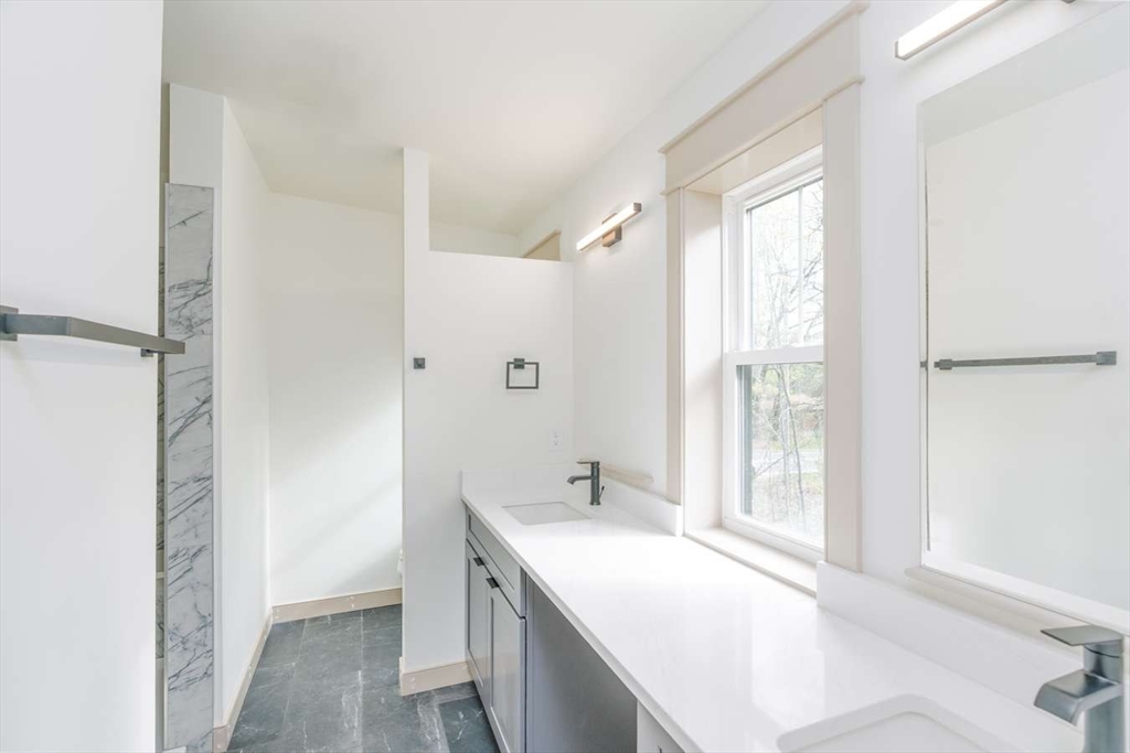 811 Burts Pit Road Northampton, MA 01062 - Photo 7 of 10 a spacious bathroom with a tub sink and mirror