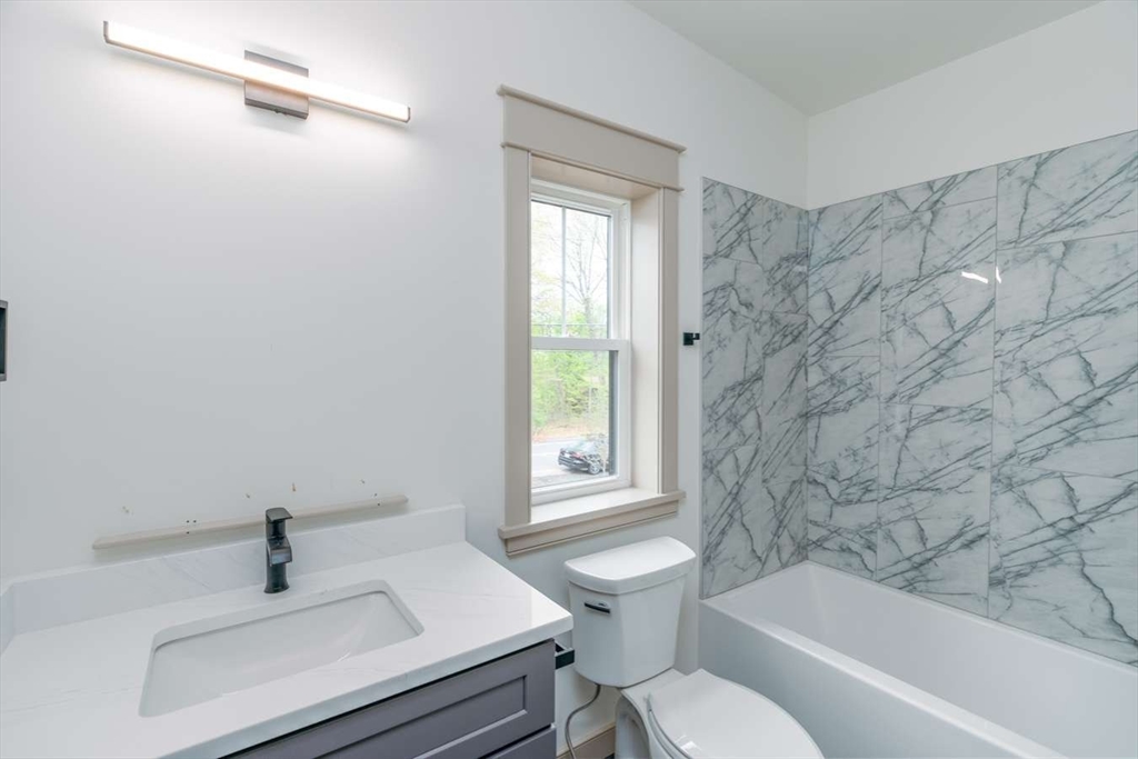 811 Burts Pit Road Northampton, MA 01062 - Photo 9 of 10 a bathroom with a sink a toilet and bathtub