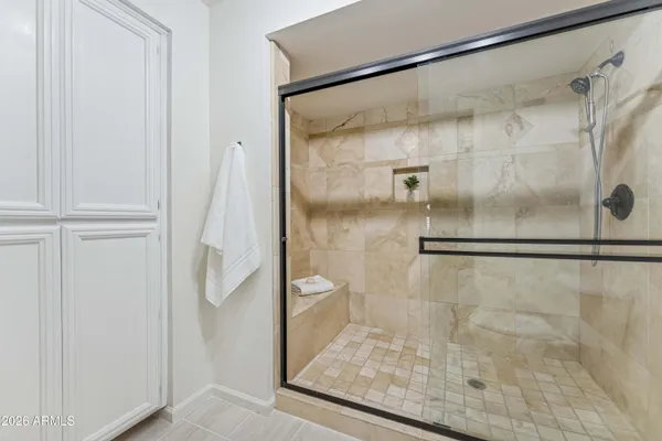 a bathroom with a granite countertop sink mirror and double