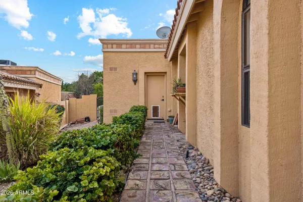 a kitchen with a sink cabinets and wooden floor