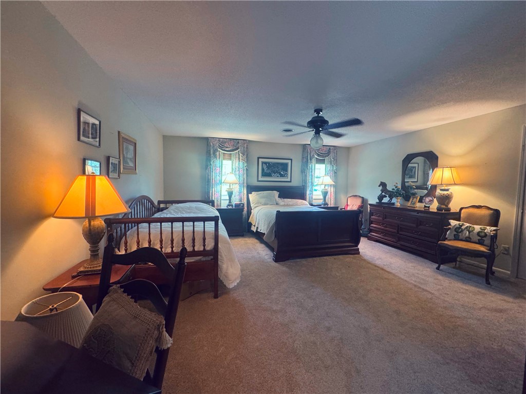 208 Knoxwood Court Anderson, SC 29621 - Photo 24 of 38 This spacious sleeping area offers comfort and ample room for relaxation.