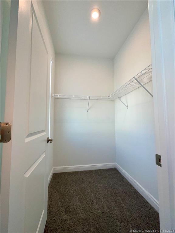 860 Southwest Bushel Trail Palm City, FL 34990 - Photo 19 of 25 a empty room with closet