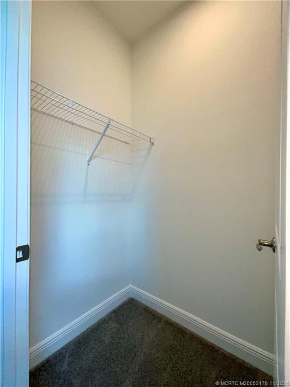 860 Southwest Bushel Trail Palm City, FL 34990 - Photo 23 of 25 a view of a room with racks on the wall
