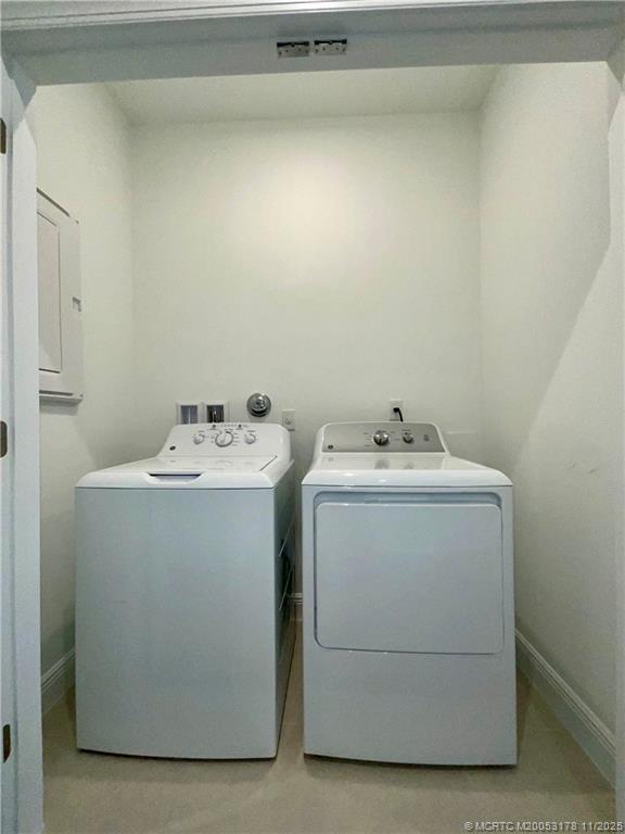 860 Southwest Bushel Trail Palm City, FL 34990 - Photo 25 of 25 a utility room with dryer and washer