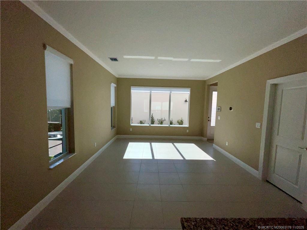 860 Southwest Bushel Trail Palm City, FL 34990 - Photo 7 of 25 a view of an empty room