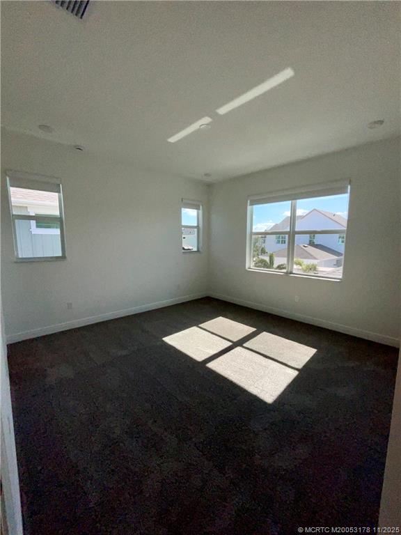 860 Southwest Bushel Trail Palm City, FL 34990 - Photo 10 of 25 a view of an empty room and window