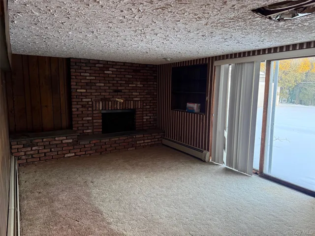 a view of fireplace and window