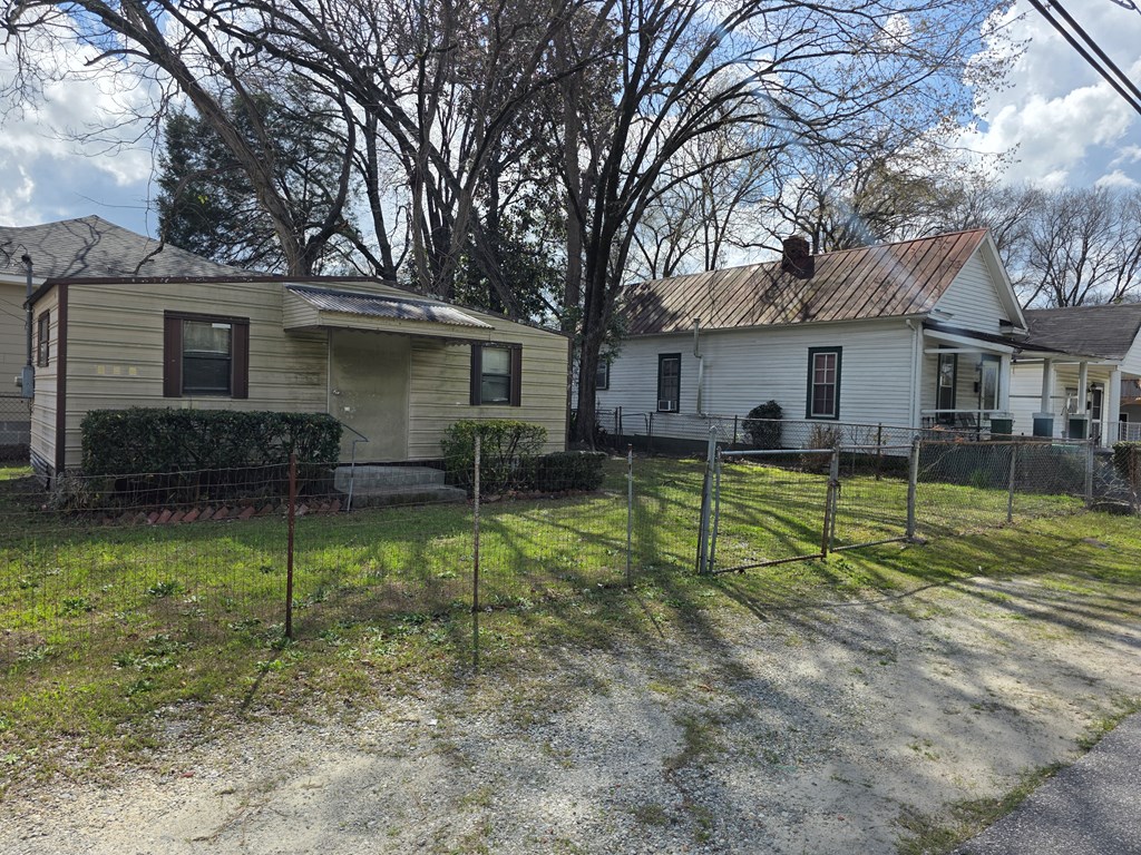 1352 24th Street Columbus, GA 31901 - Photo 3 of 18 a view of a house with backyard and a tree