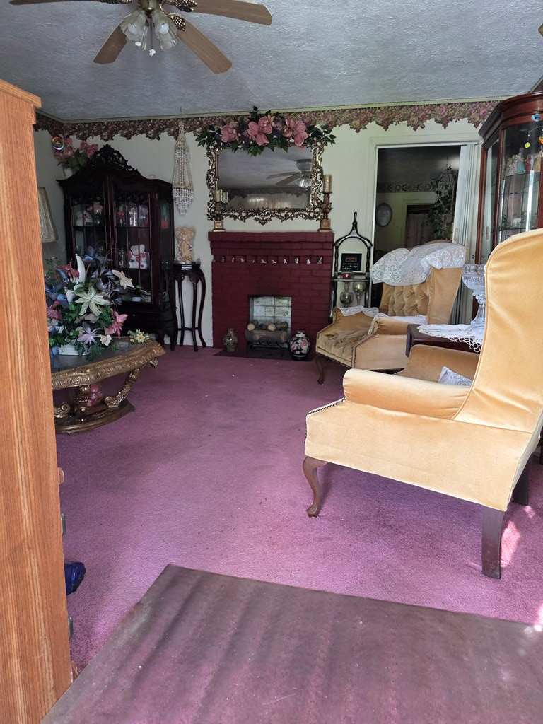 1352 24th Street Columbus, GA 31901 - Photo 4 of 18 a living room with furniture and a fireplace