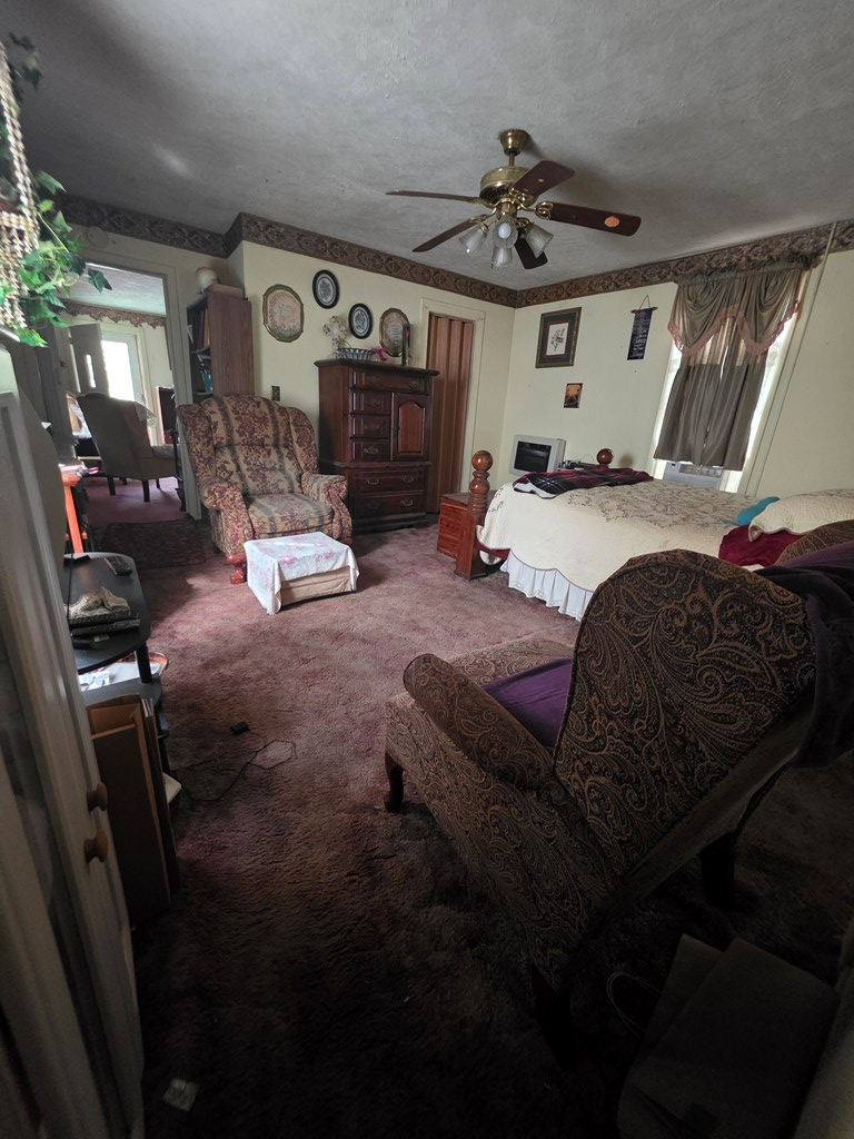 1352 24th Street Columbus, GA 31901 - Photo 7 of 18 a living room with furniture and a fireplace