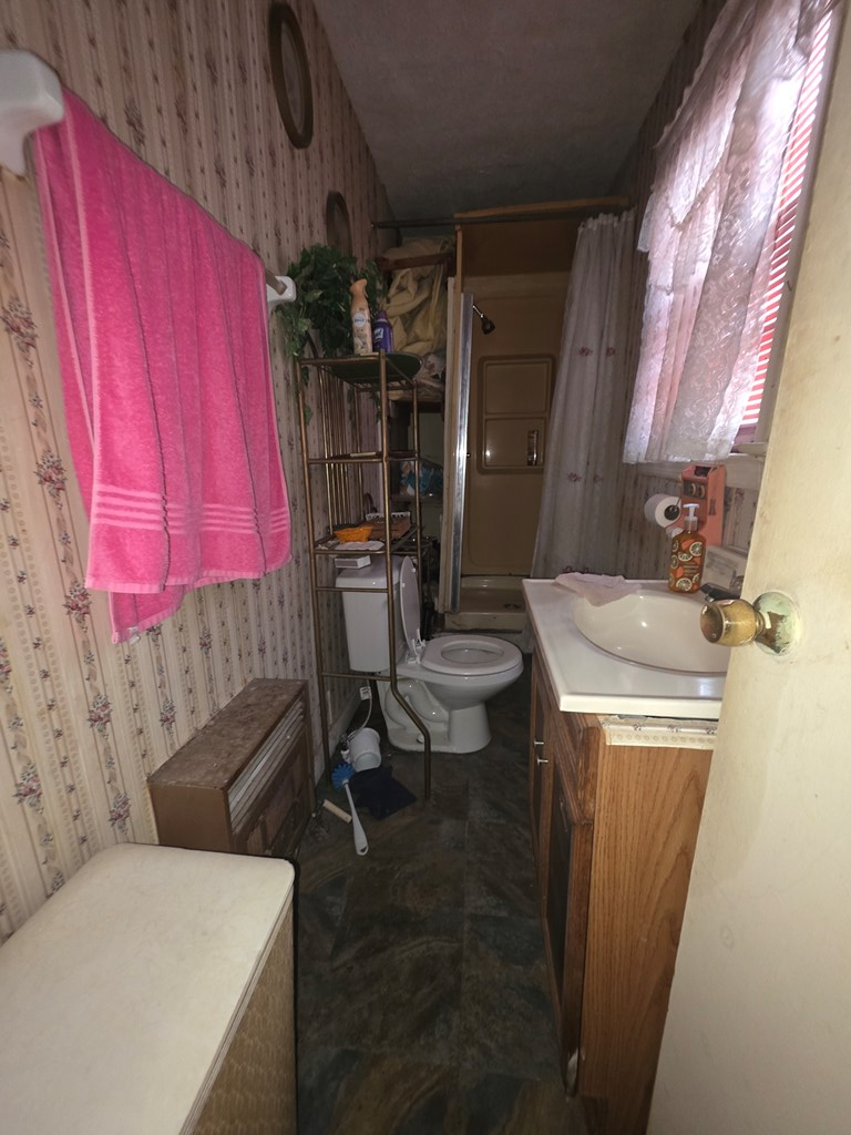 1352 24th Street Columbus, GA 31901 - Photo 8 of 18 a bathroom with a sink a toilet and tub