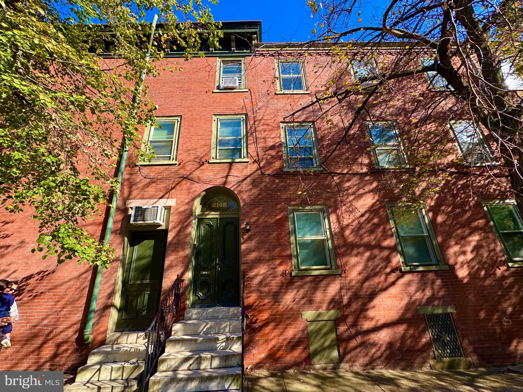 2148 Green Street, Unit 2 Philadelphia, PA 19130 - Photo 27 of 27 a view of a house with a tree