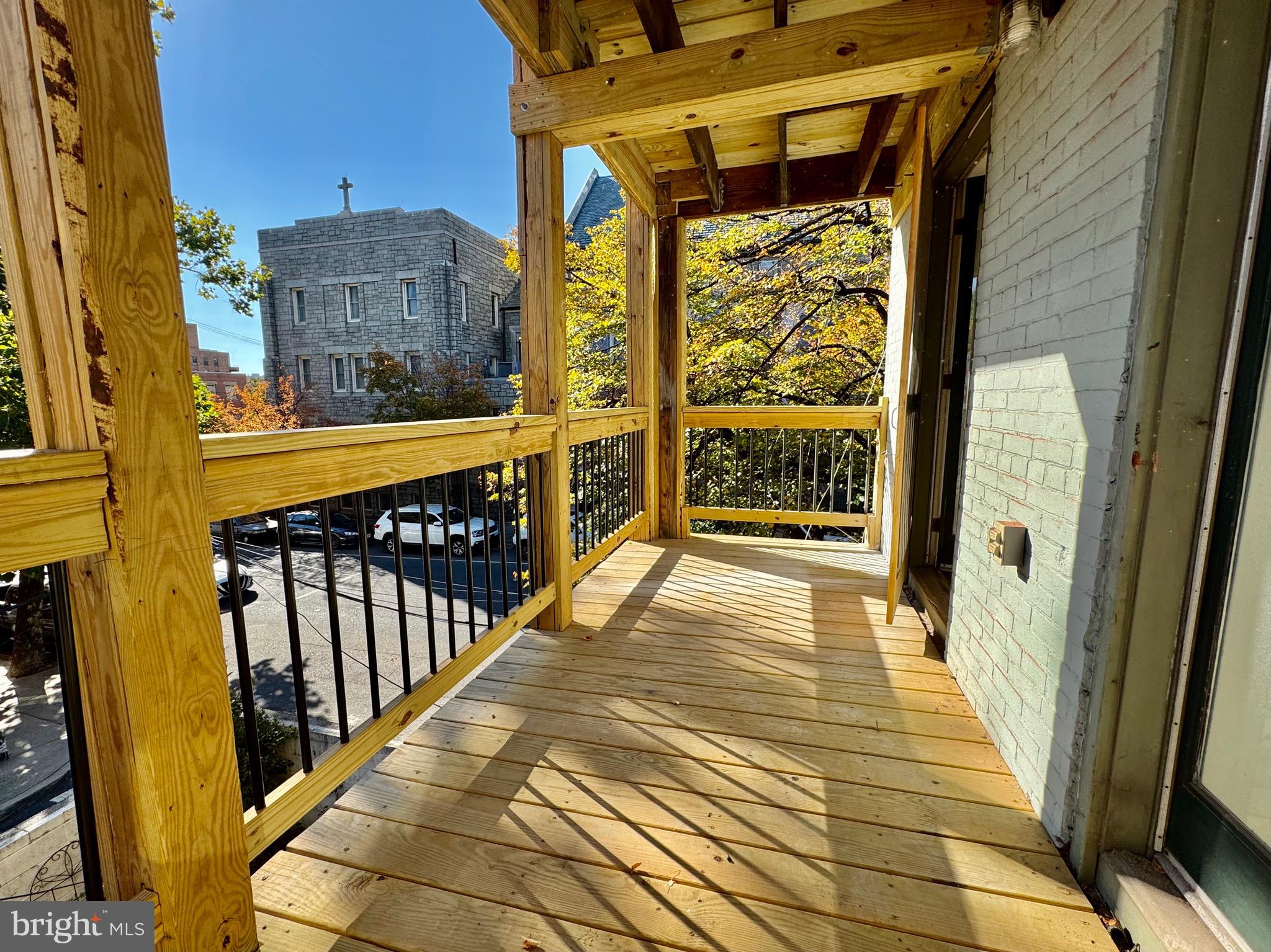 2148 Green Street, Unit 2 Philadelphia, PA 19130 - Photo 6 of 27 a view of a porch with wooden floor and door