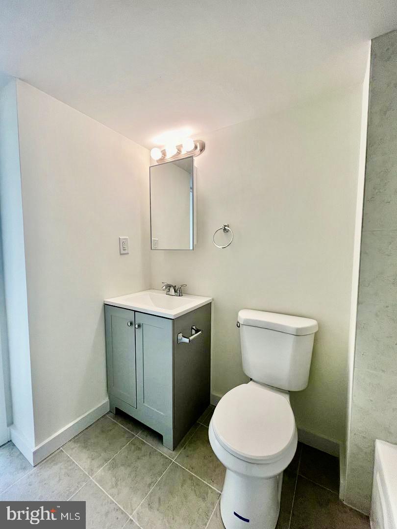 2148 Green Street, Unit 2 Philadelphia, PA 19130 - Photo 10 of 27 a bathroom with a toilet sink and mirror
