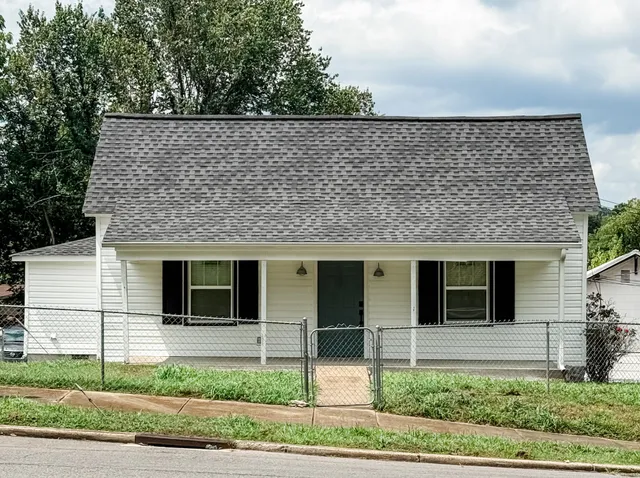 a front view of a house with garage