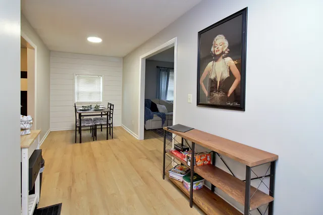a view of a livingroom with furniture and wooden floor