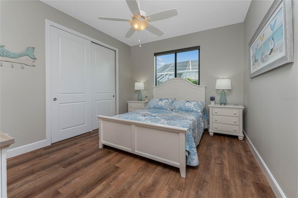 2730 Rio Court Punta Gorda, FL 33950 - Photo 19 of 71 a bedroom with a bed and a chandelier