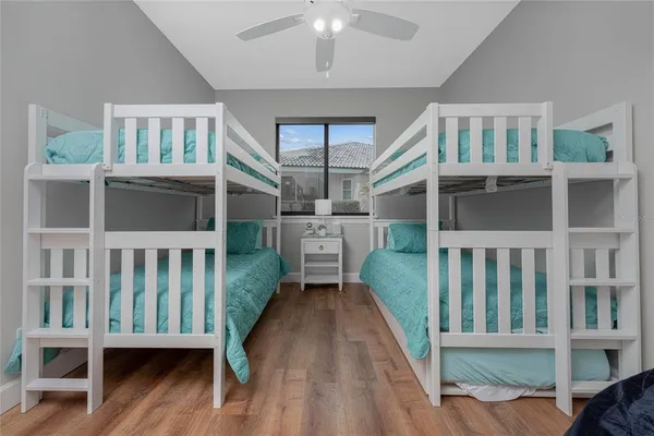 a spacious bathroom with a tub shower and mirror