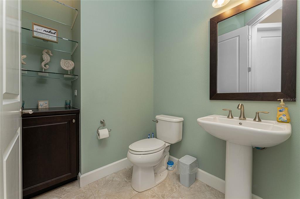 2730 Rio Court Punta Gorda, FL 33950 - Photo 31 of 71 a bathroom with a sink toilet and mirror