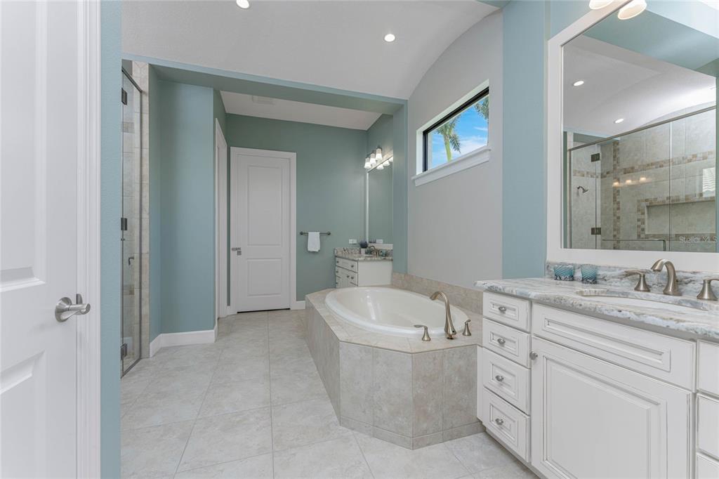 2730 Rio Court Punta Gorda, FL 33950 - Photo 36 of 71 a bathroom with a double vanity sink a toilet and a mirror