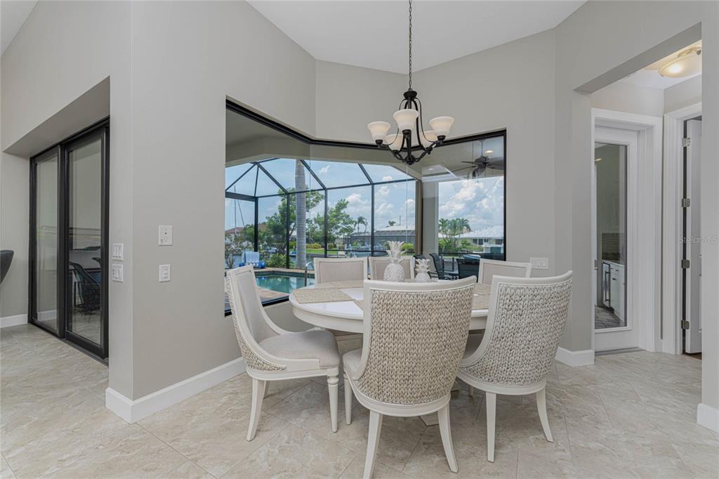 2730 Rio Court Punta Gorda, FL 33950 - Photo 5 of 71 a dining room with furniture a chandelier and window