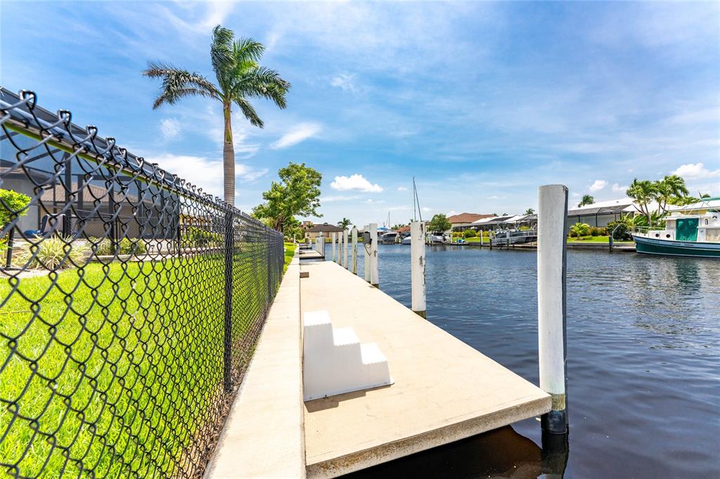 2730 Rio Court Punta Gorda, FL 33950 - Photo 57 of 71 a view of swimming pool with a table and chairs