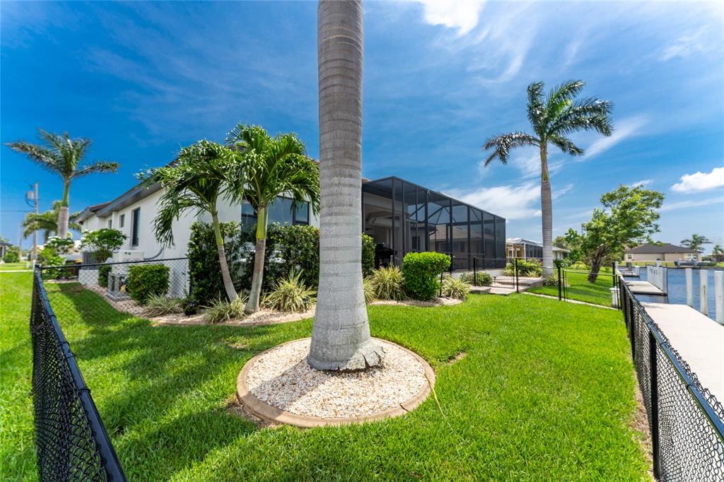 2730 Rio Court Punta Gorda, FL 33950 - Photo 58 of 71 a front view of a house with a yard and potted plants