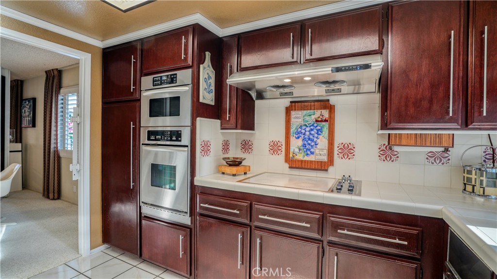 2117 Capuchin Way Claremont, CA 91711 - Photo 13 of 36 a kitchen with stainless steel appliances granite countertop a refrigerator and a sink