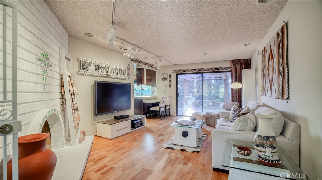 2117 Capuchin Way Claremont, CA 91711 - Photo 18 of 36 a living room with furniture and a flat screen tv